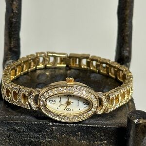 Peire Bernie oval shape Goldtone and Rhinestone women’s watch.